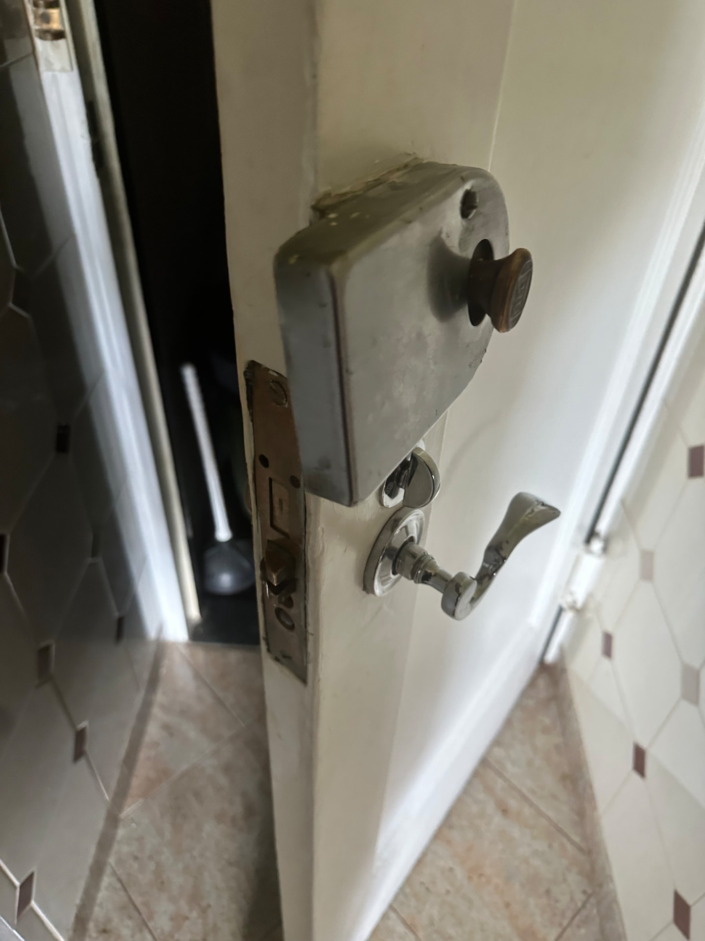 Rim lock and mortise latch serviced on an apartment door